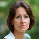 Elara Vance, founder of Rainforest Bloom, a botanist and Oregonian, smiling thoughtfully